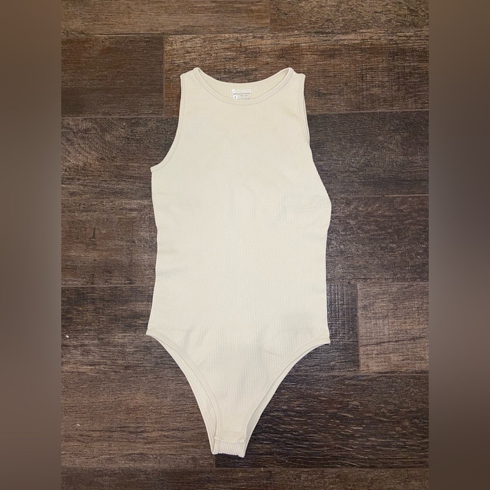 OQQ Cream Colored Body Suit. Size Small.